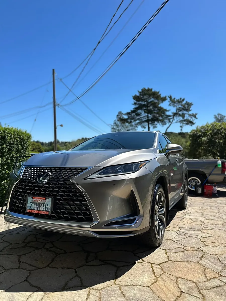 glossy vehicle exterior after hand wash and exterior detailing
